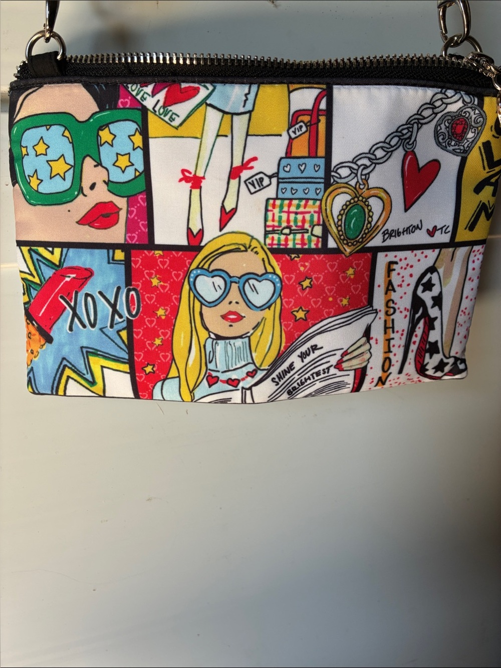 Brighton Glam Girl Crossbody Pouch featuring Tom Clancy artwork.🖼️